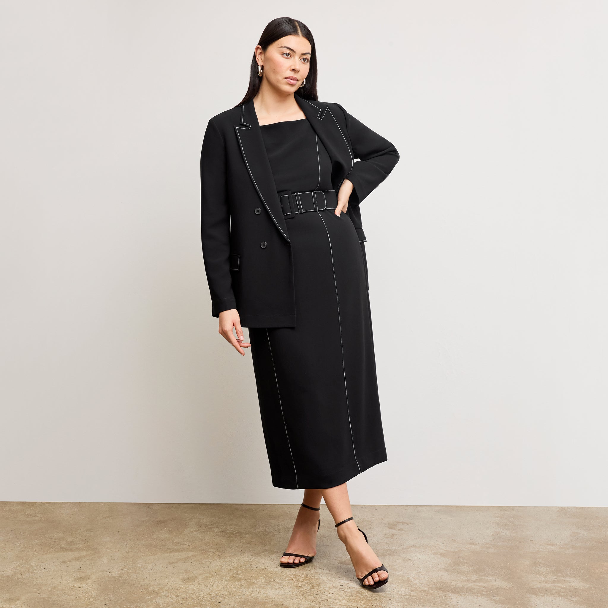 front image of a woman wearing the o'hara jacket in black with topstitch 