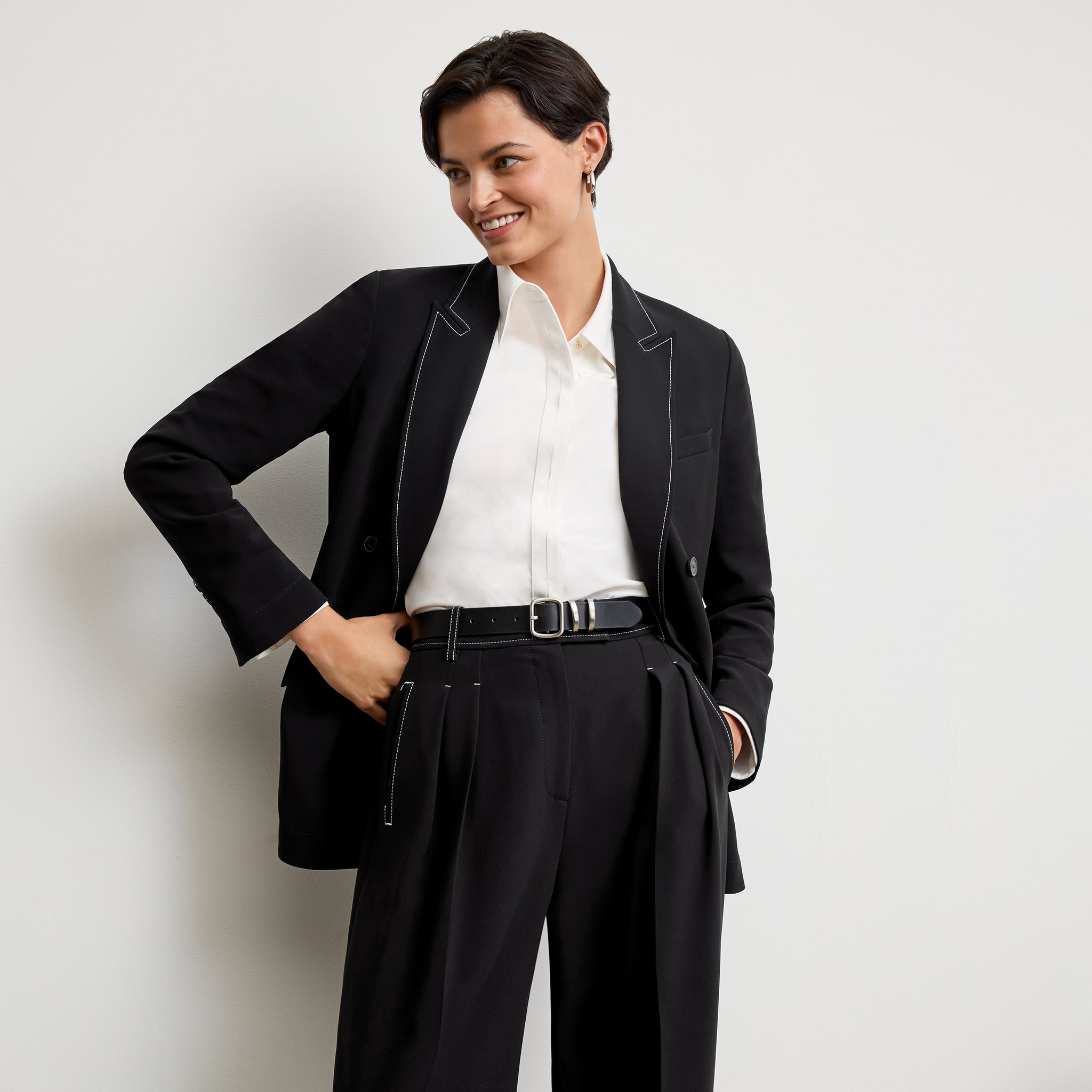 front image of a woman wearing the o'hara jacket in black with topstitch 