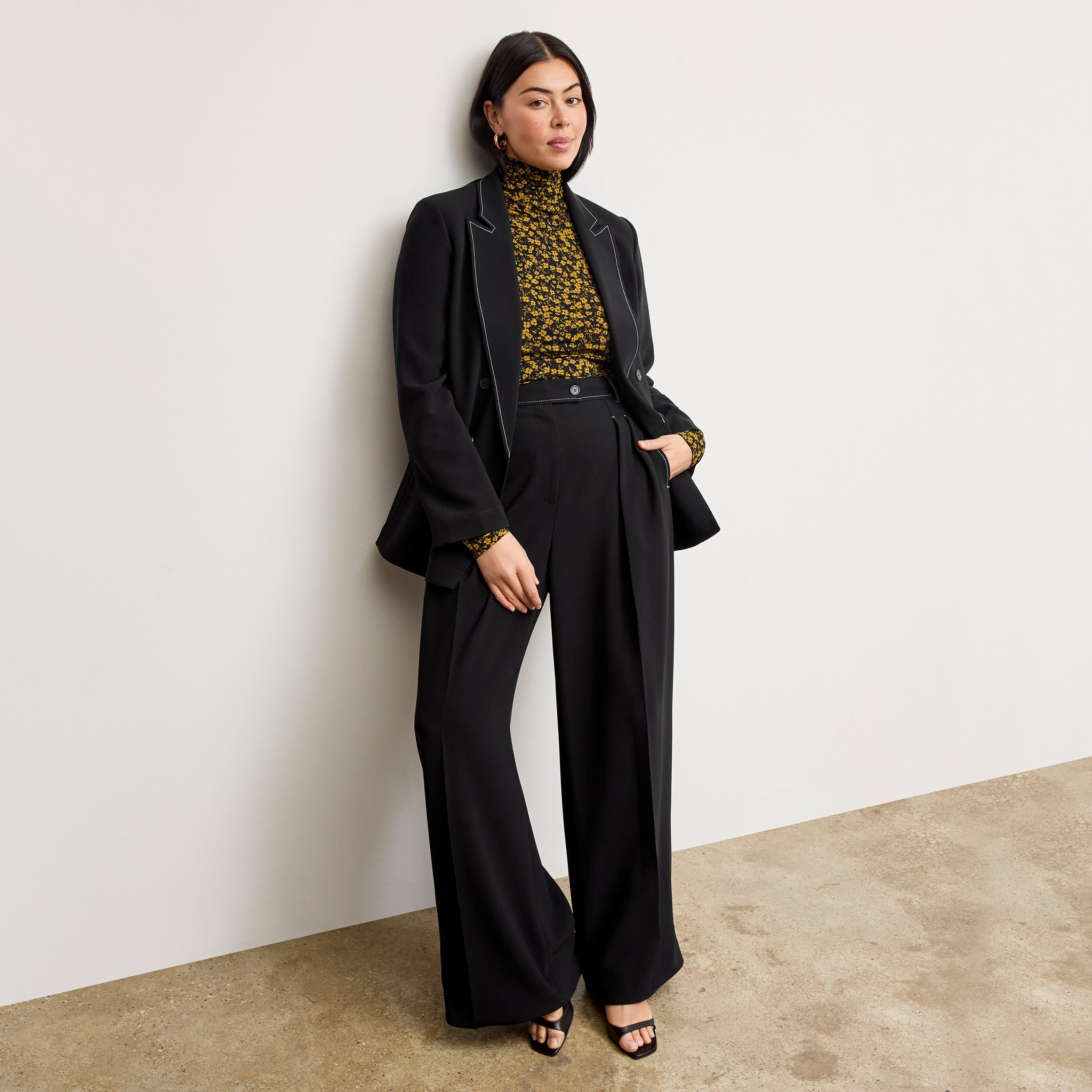 front image of a woman wearing the bia pants in black with topstitch