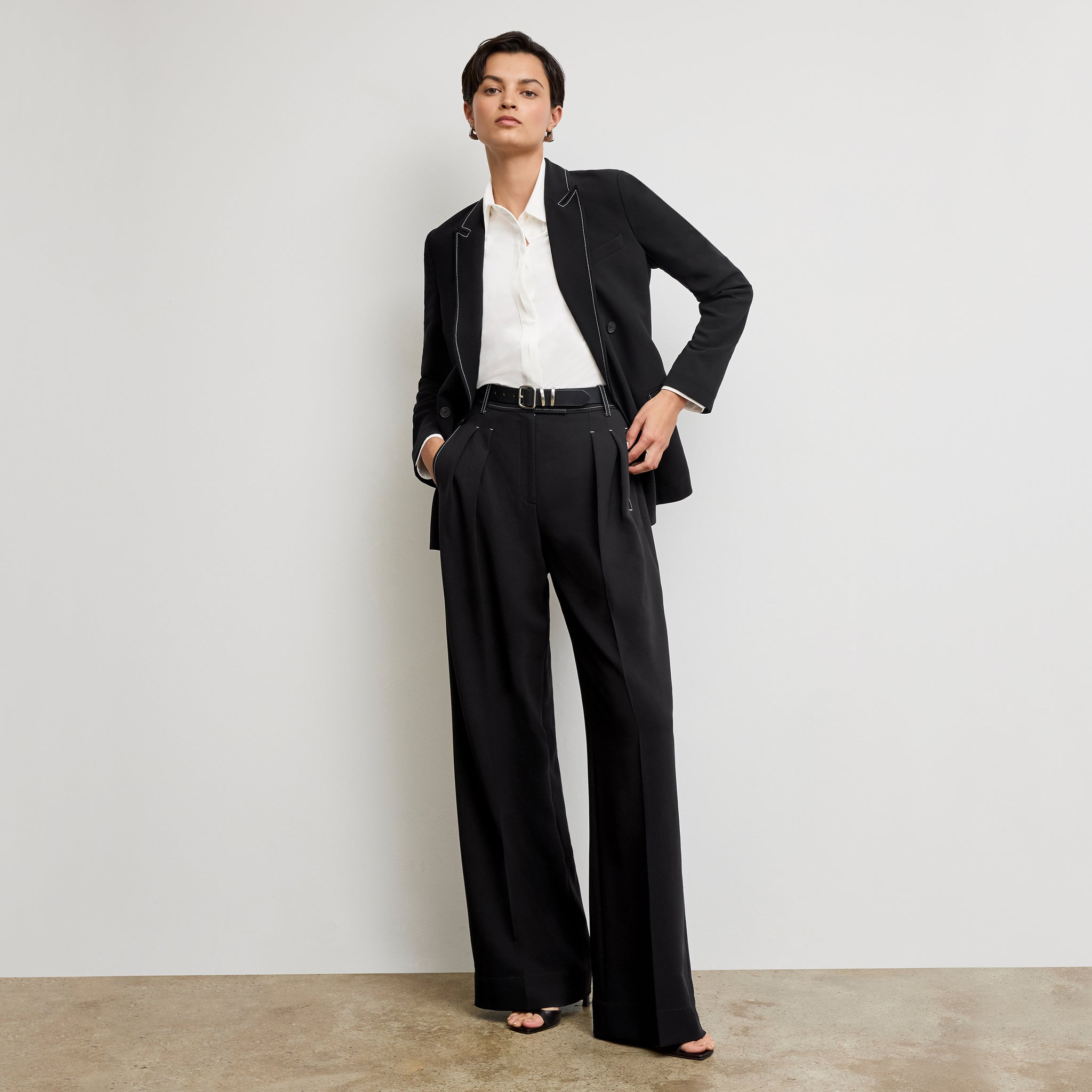front image of a woman wearing the bia pants in black with topstitch