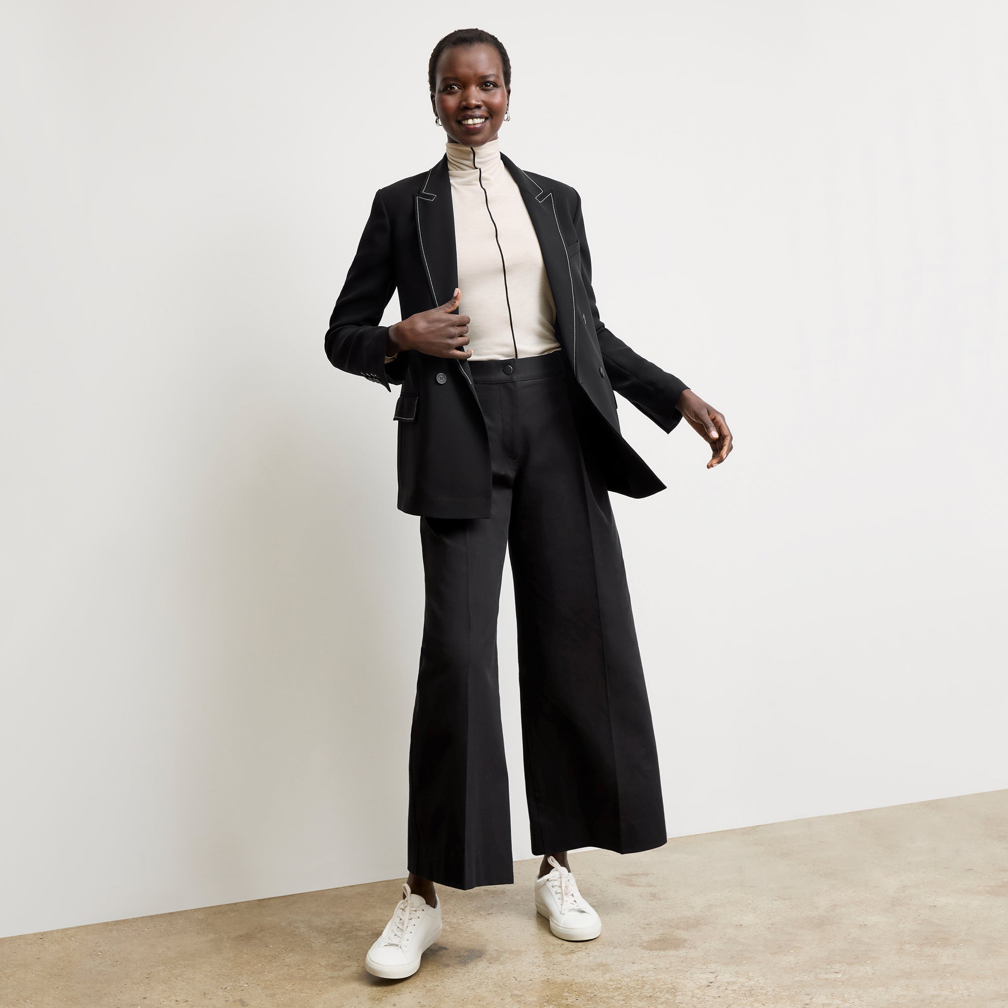 Front image of a woman wearing the Harrison Pant in Black
