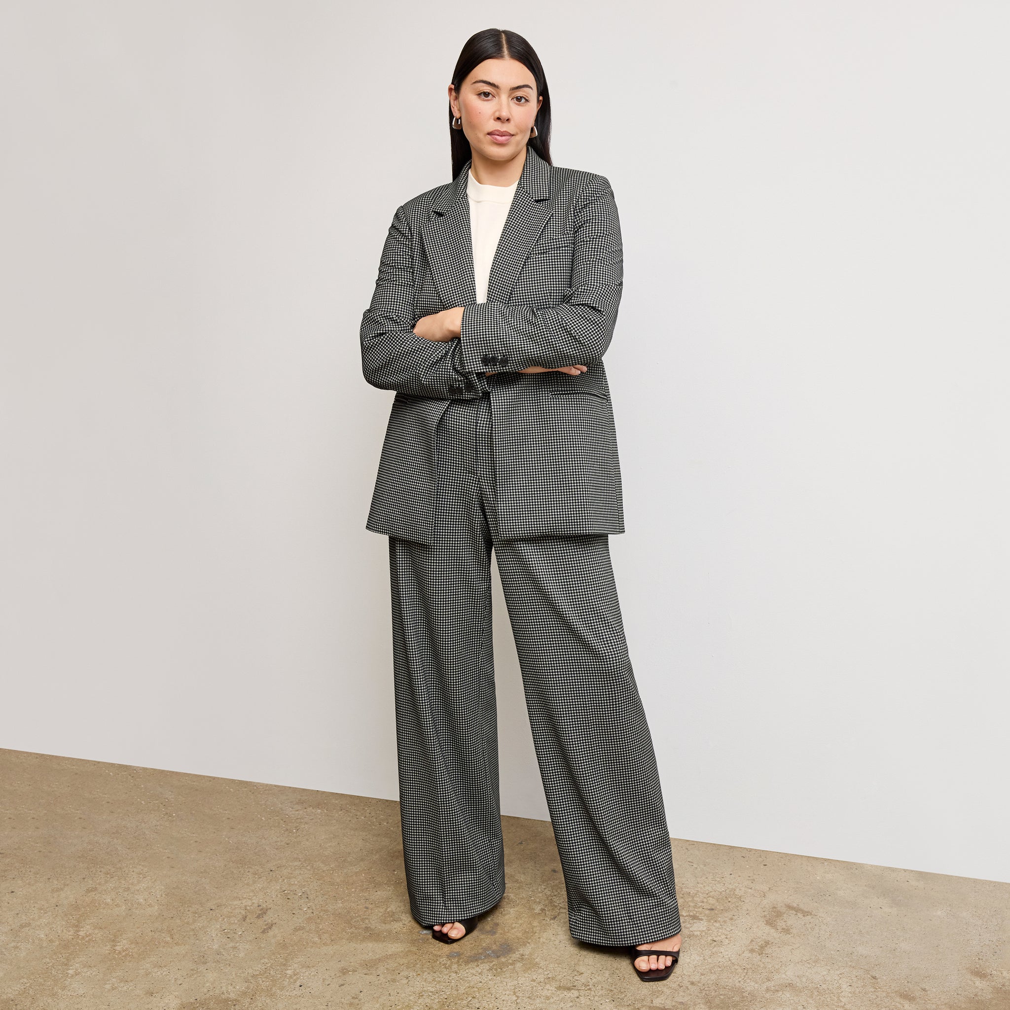 front image of a woman wearing the rossi blazer in classic check