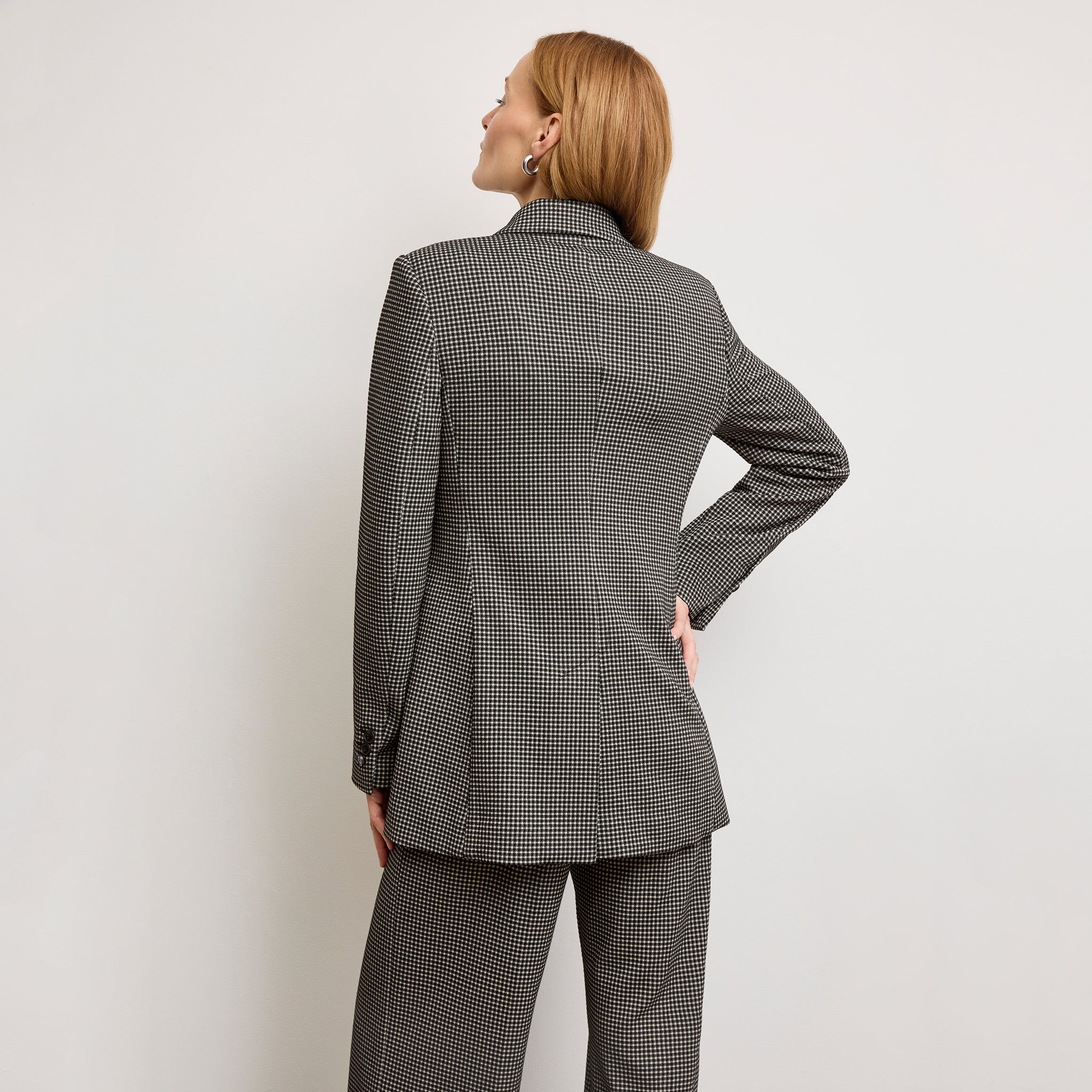 back image of a woman wearing the rossi blazer in classic check