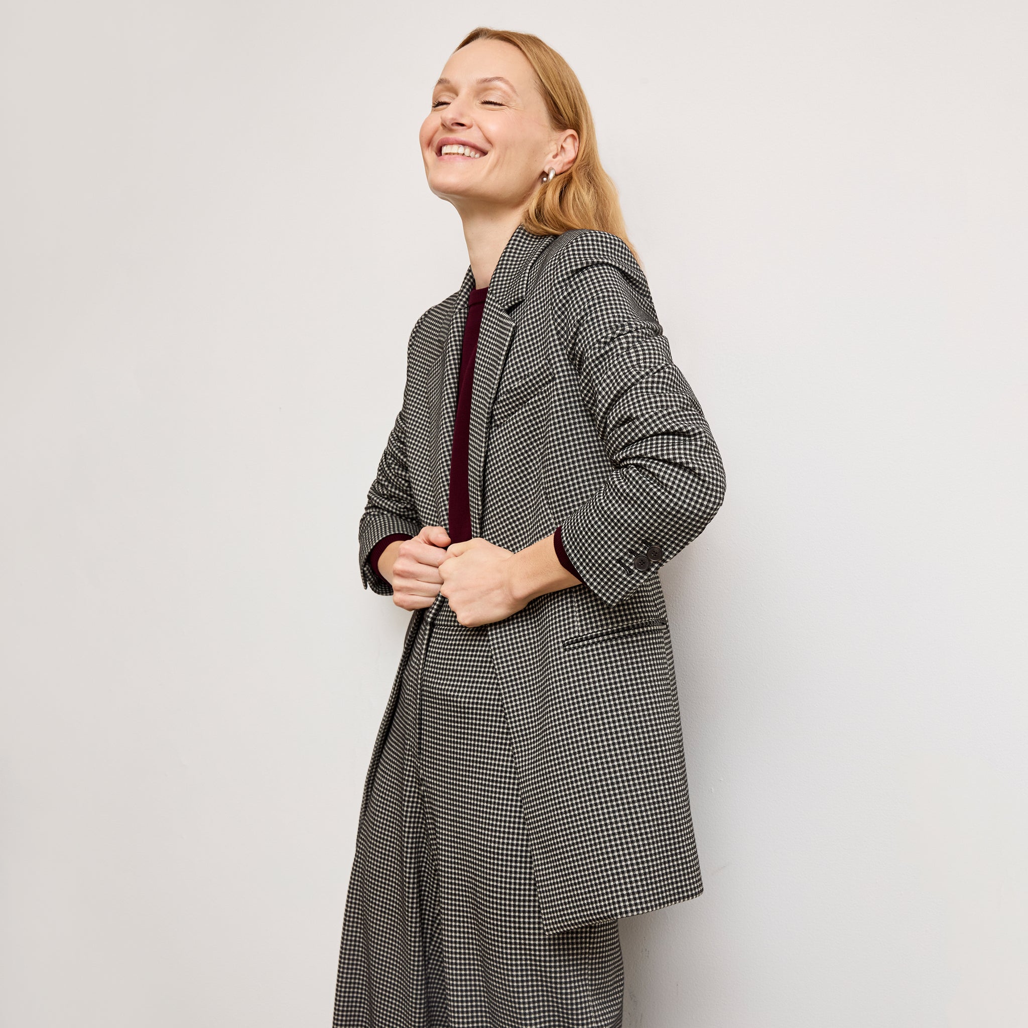 front image of a woman wearing the rossi blazer in classic check