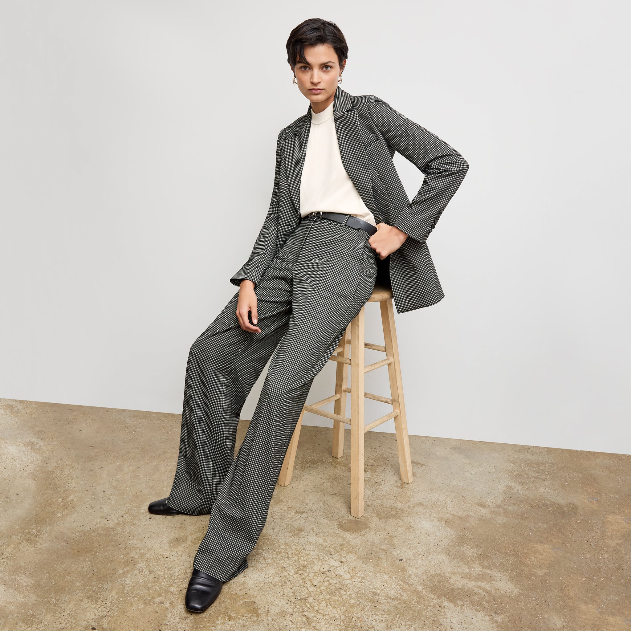 front image of a woman wearing the rossi blazer in classic check