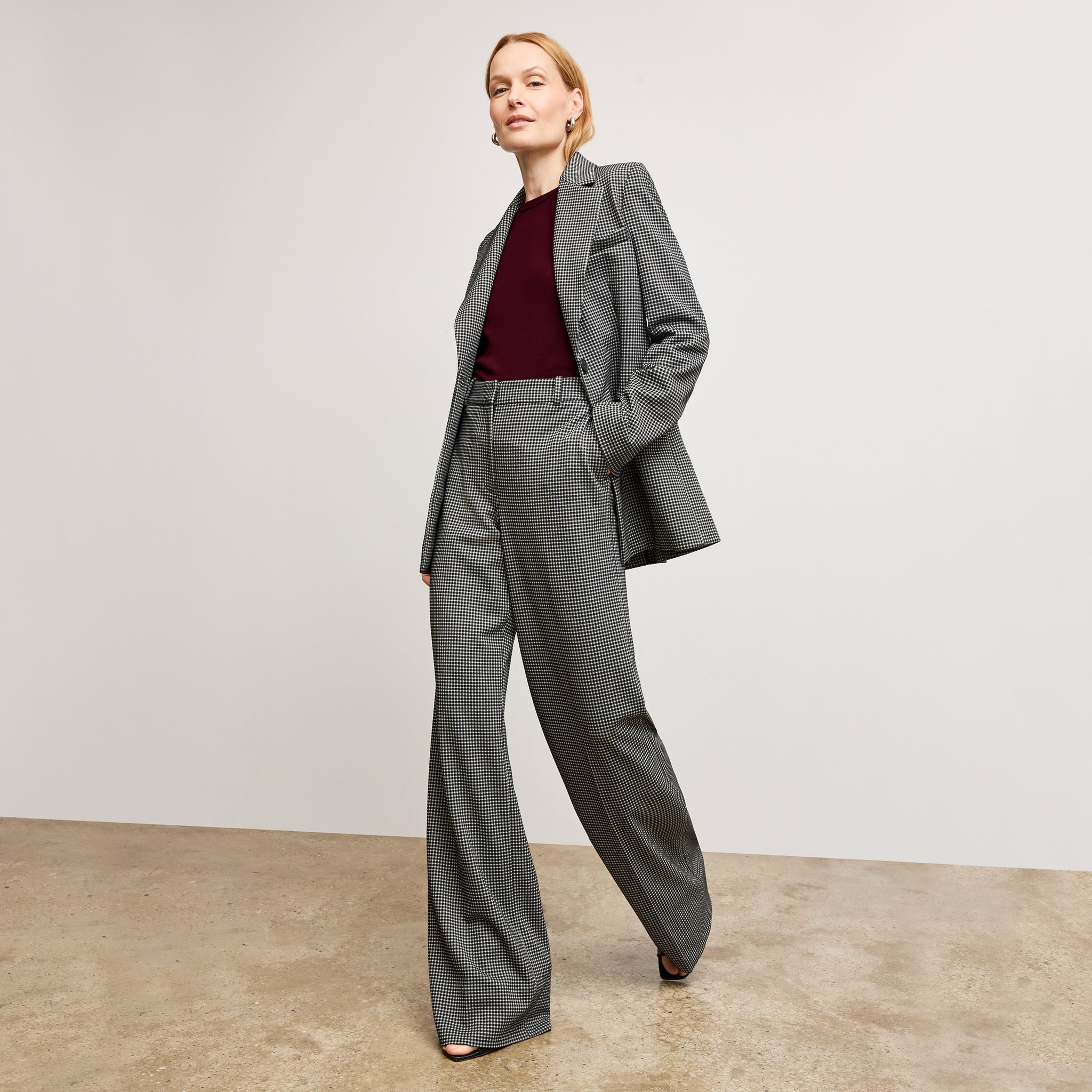 front image of a woman wearing the rossi blazer in classic check