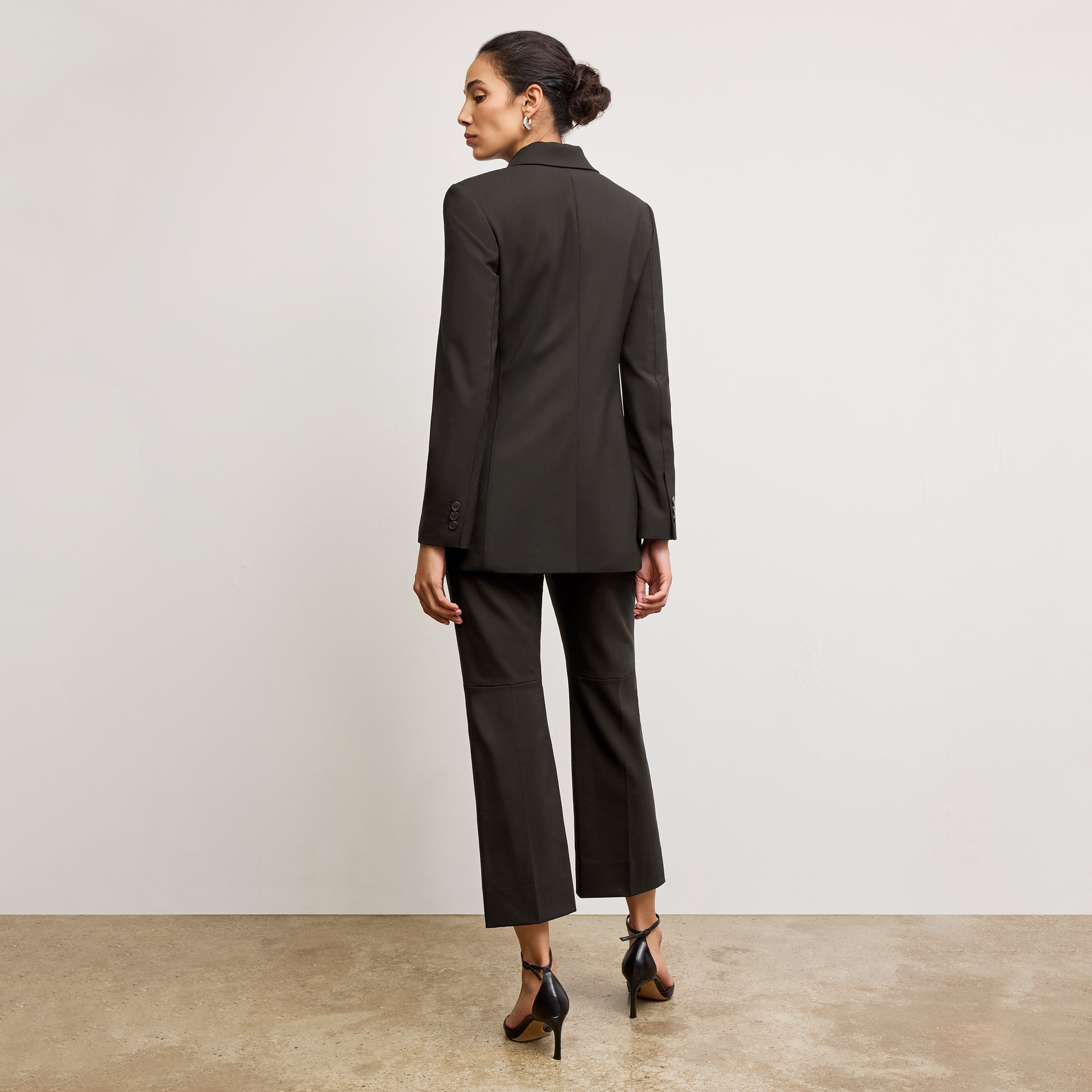 back image of a woman wearing the rossi blazer in black