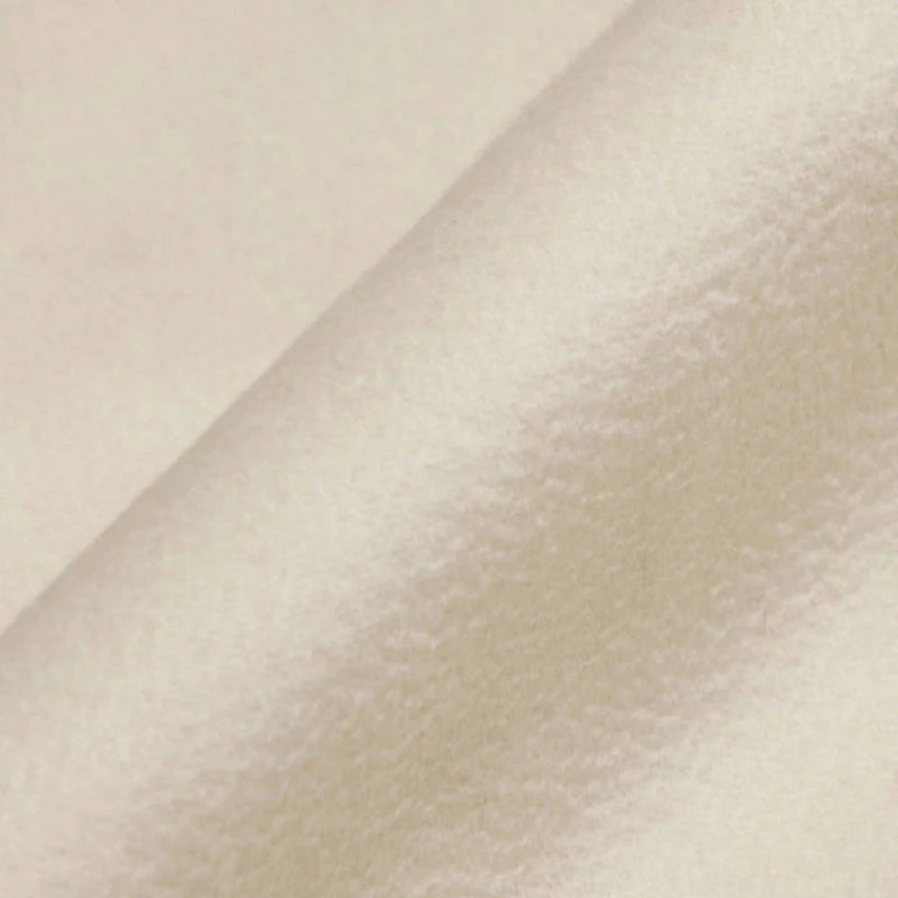 Close-up of beige fabric with a subtle texture