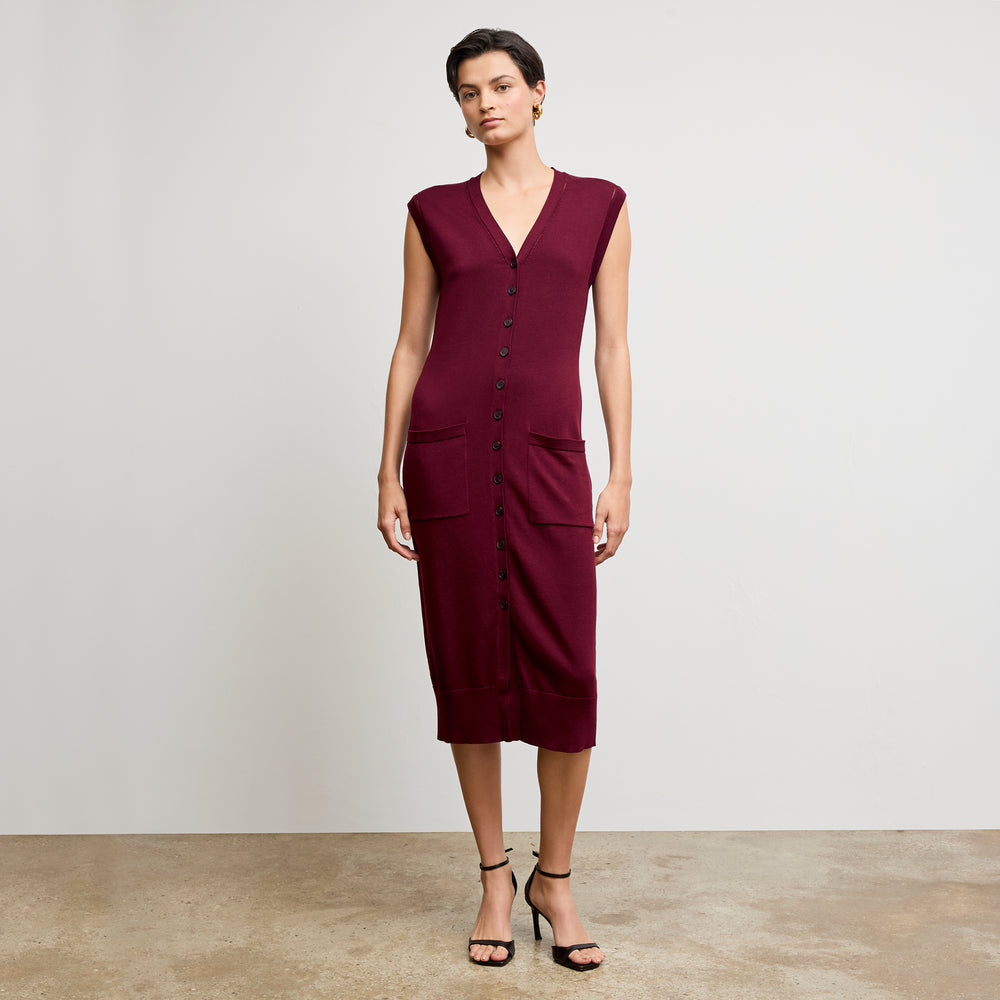 front image of a woman wearing the toula dress in syrah