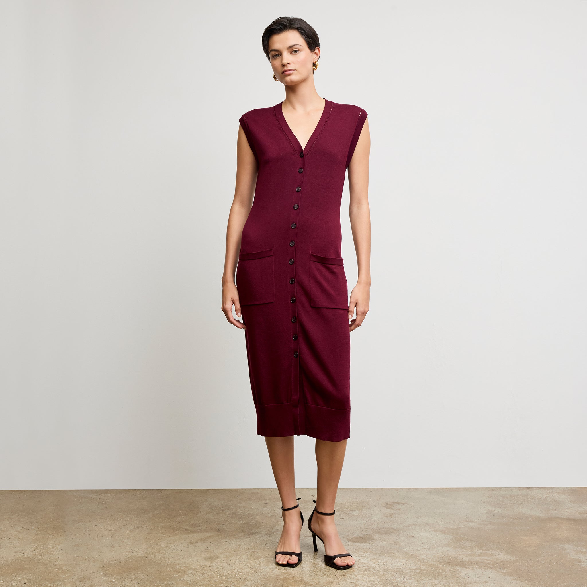 front image of a woman wearing the toula dress in syrah