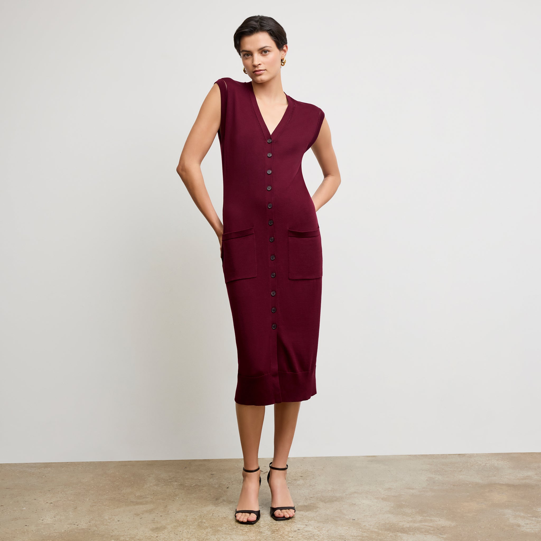 front image of a woman wearing the toula dress in syrah 