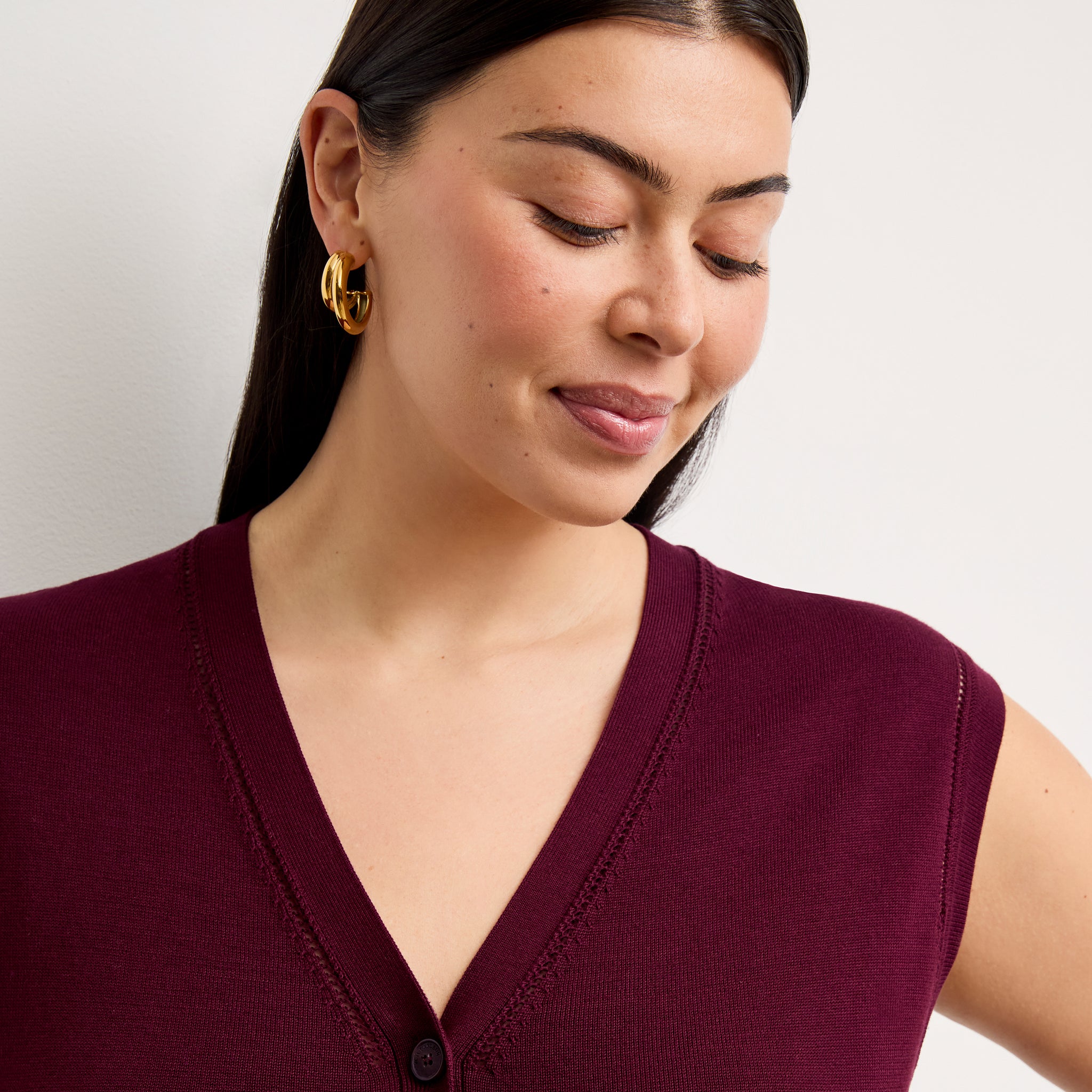 front image of a woman wearing the toula dress in syrah