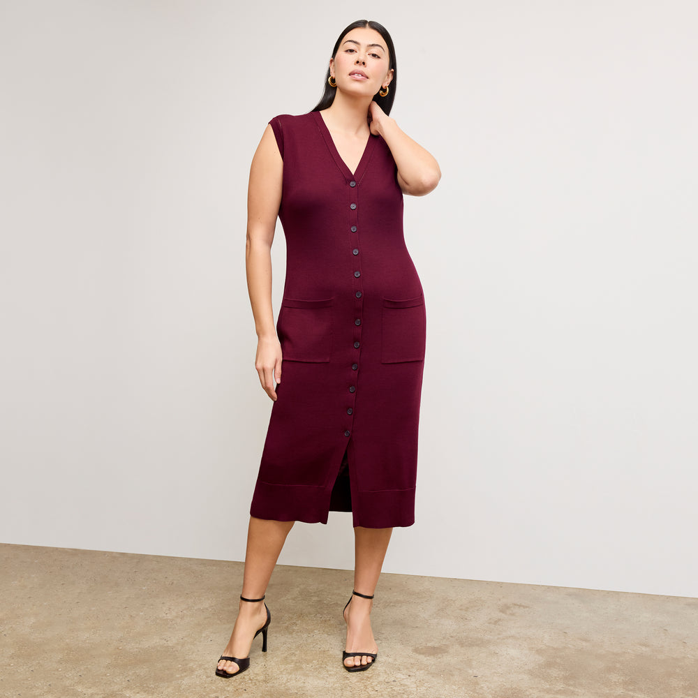front image of a woman wearing the toula dress in syrah