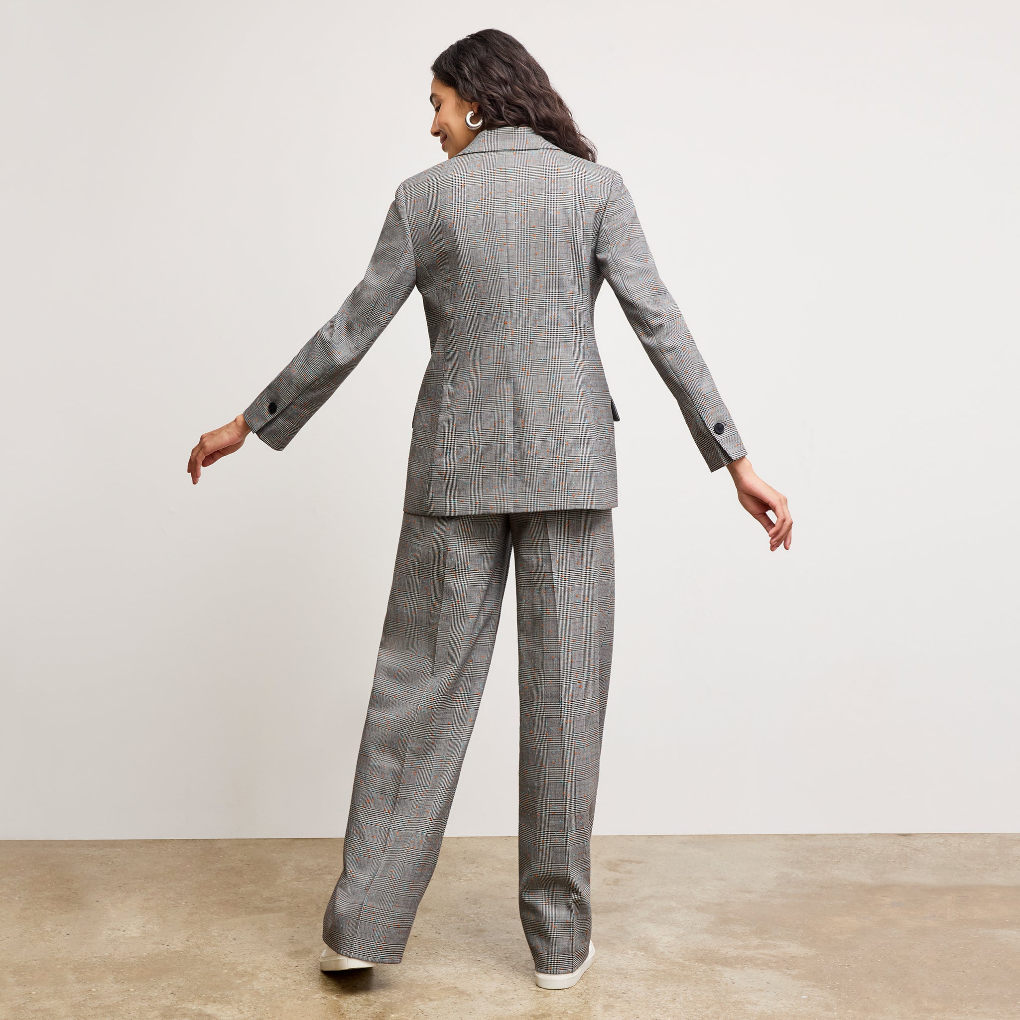 back image of a woman wearing the Tyner Blazer in Sharkskin in Mixed Check