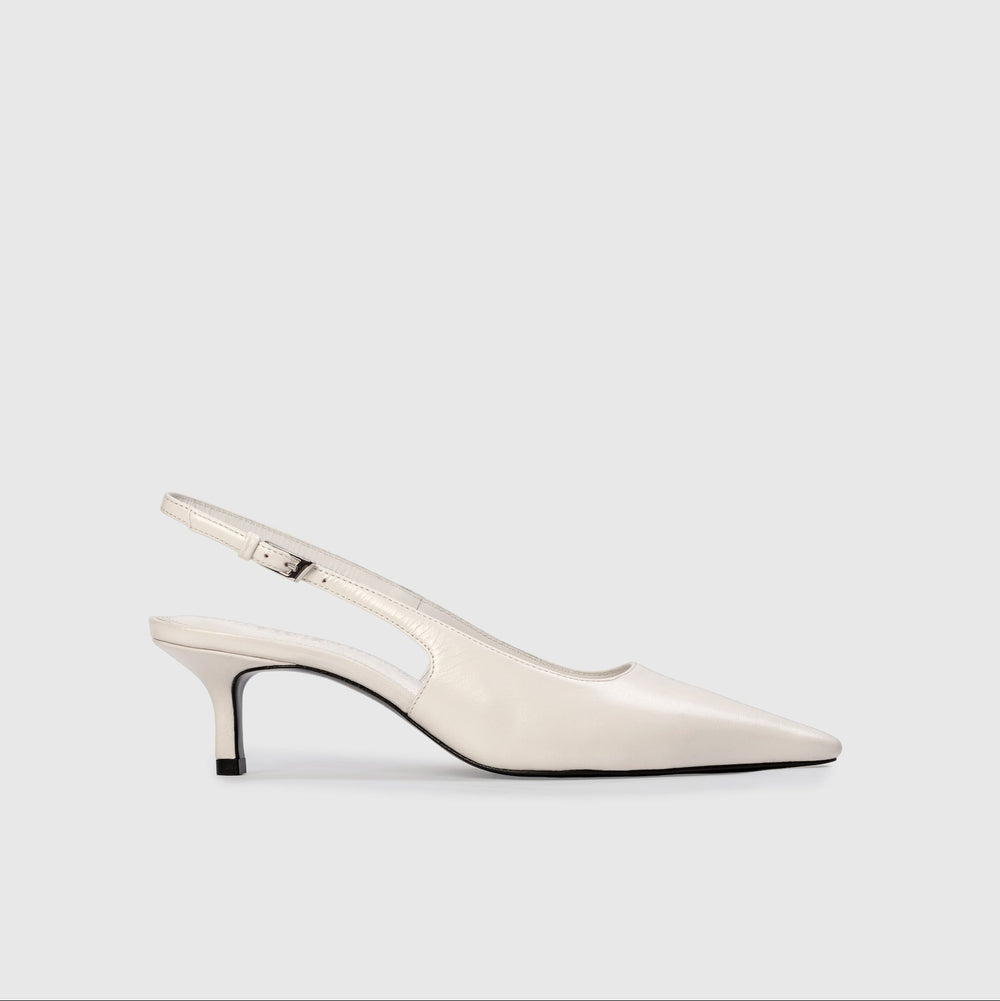 White slingback shoe on a light gray background