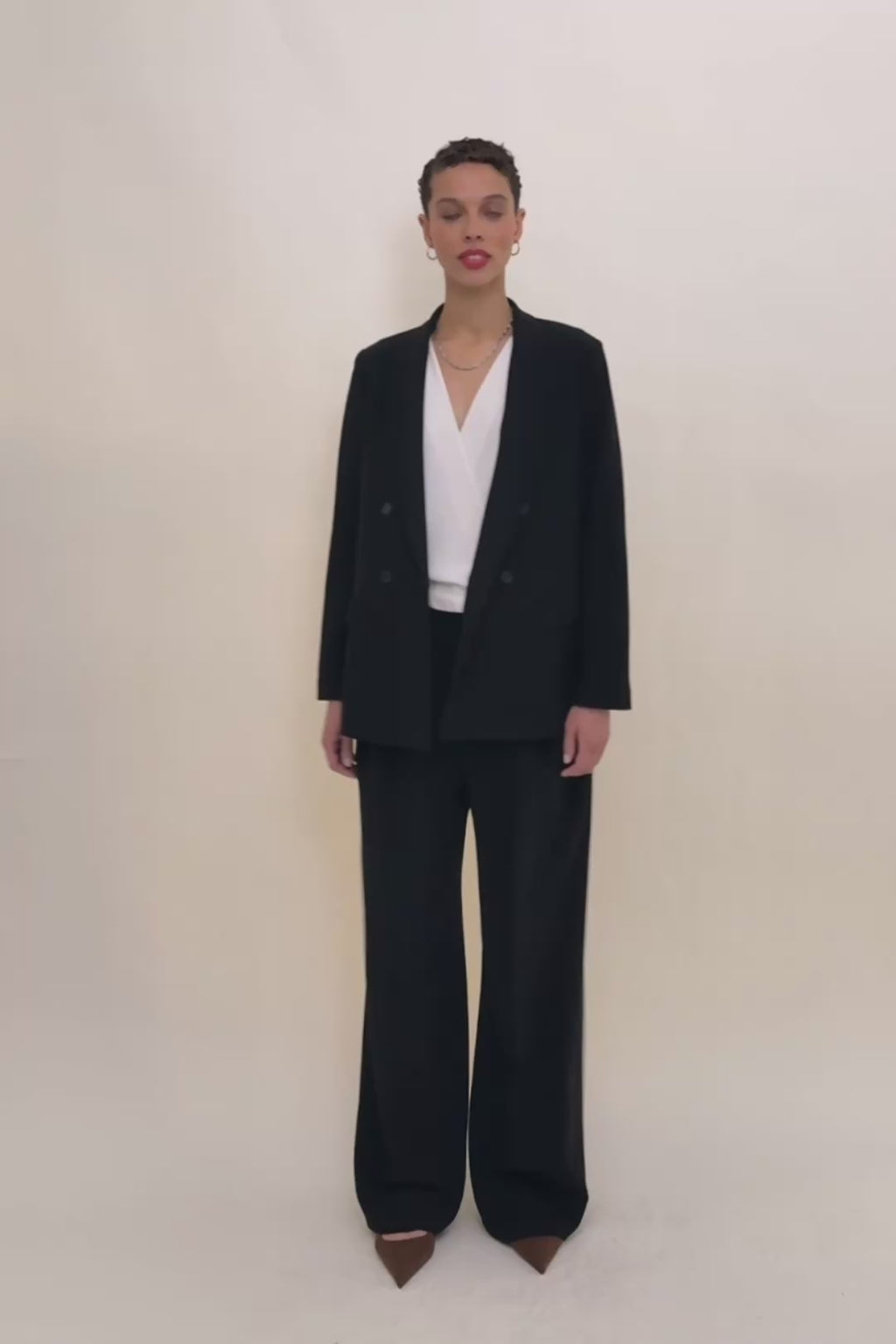 woman in black suit.