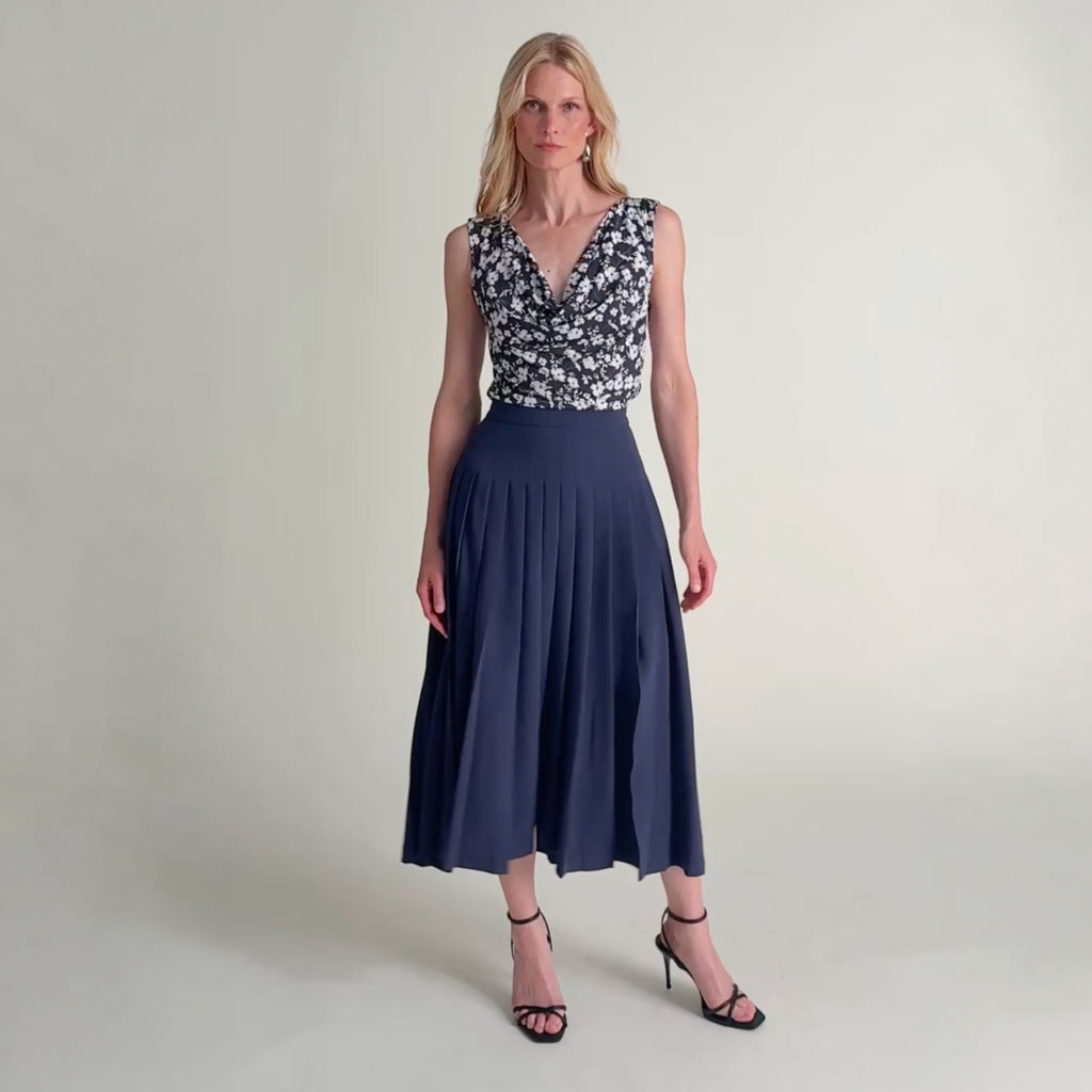 Woman wearing the Plaka skirt and Franka top. 
