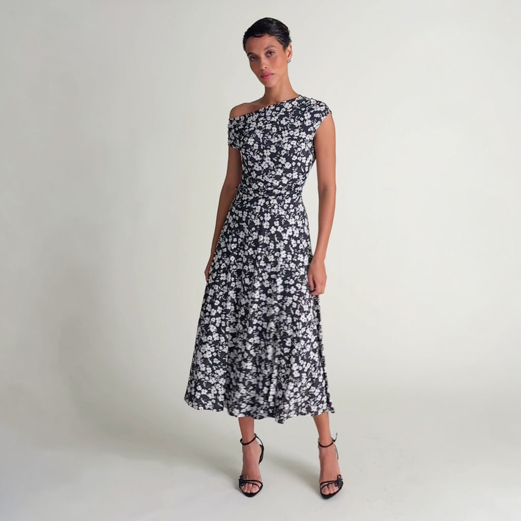 Woman wearing the Margare top and Ara skirt in happy floral light printed jersey