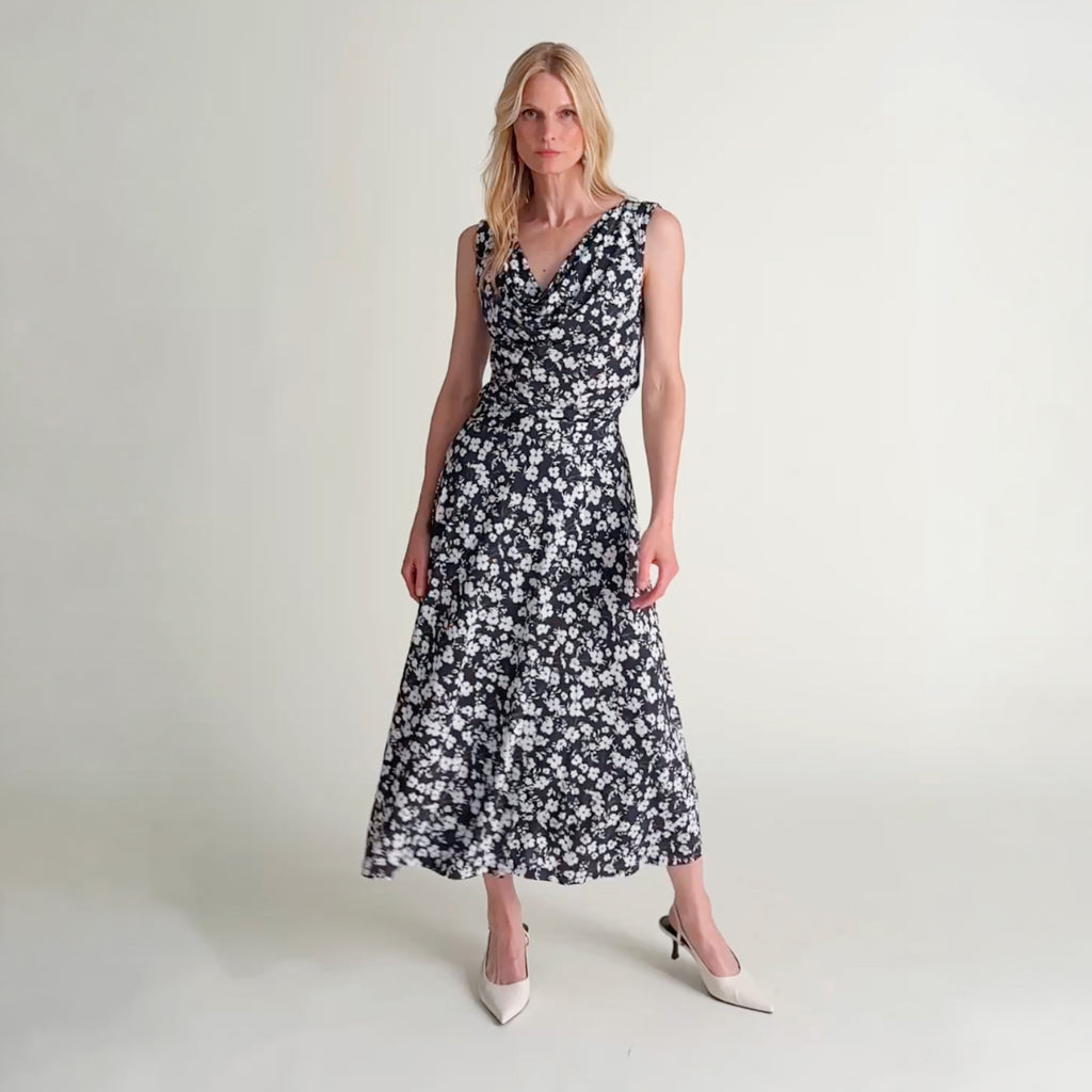 Woman wearing the Cece top and Ara skirt in happy floral