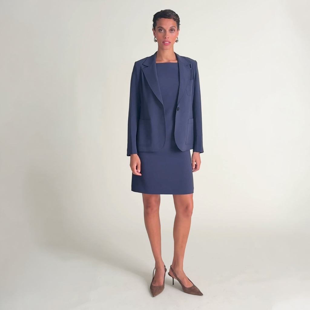 Woman wearing the madge dress and soma blazer in oxford