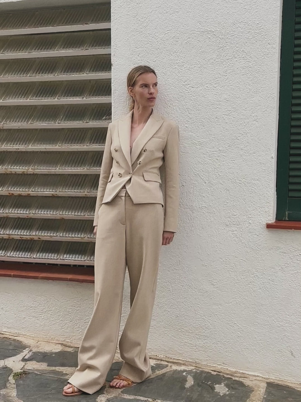 woman in beige suiting.