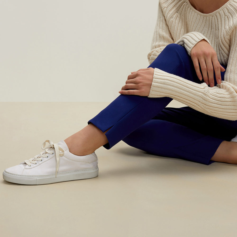 Detail image of a woman standing wearing the Marais pant in starry night