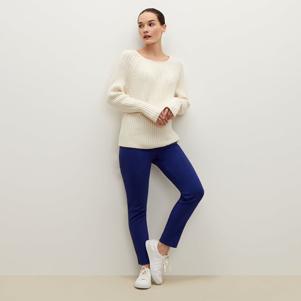Side image of a woman standing wearing the Marais pant in starry night