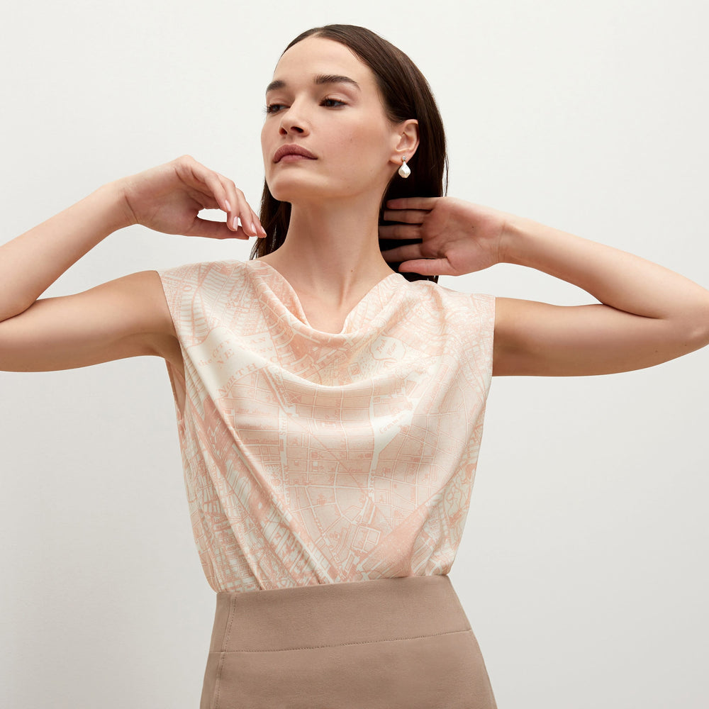 Detail image of a woman standing wearing the Rowling top in ivory / cameo