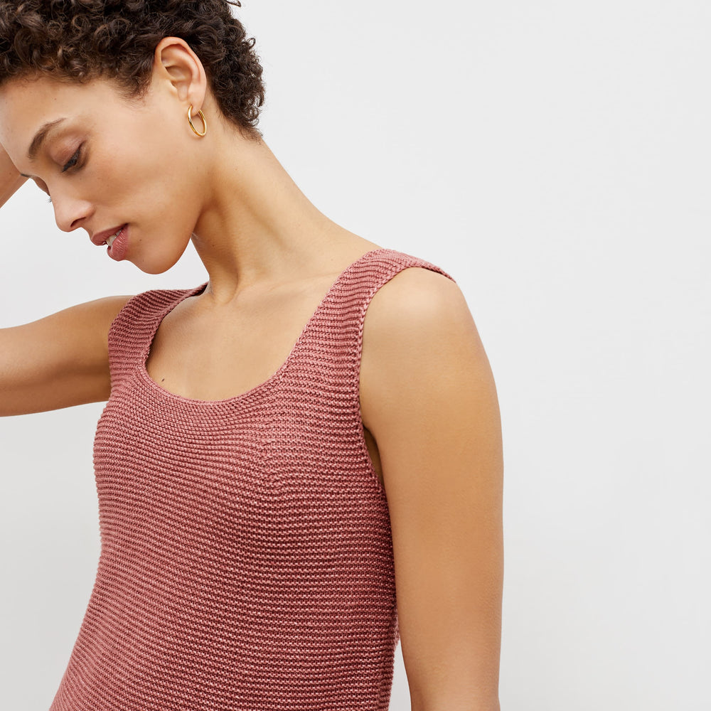 Detail image of a woman standing wearing the adele tunic in copper