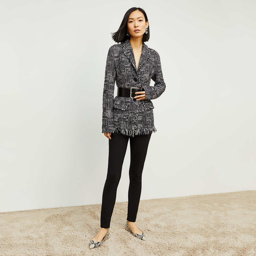 Front image of a woman standing wearing the curie pant in black