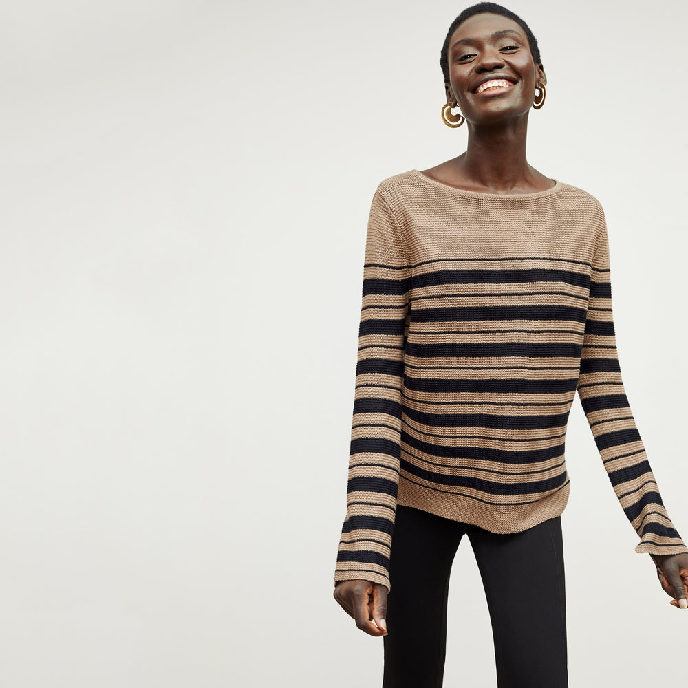 Front image of a woman standing wearing the Samara Sweater—Knit Linen in Oak / Black
