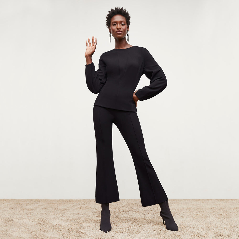 Front image of a woman standing wearing the Shiloh Pant in Black