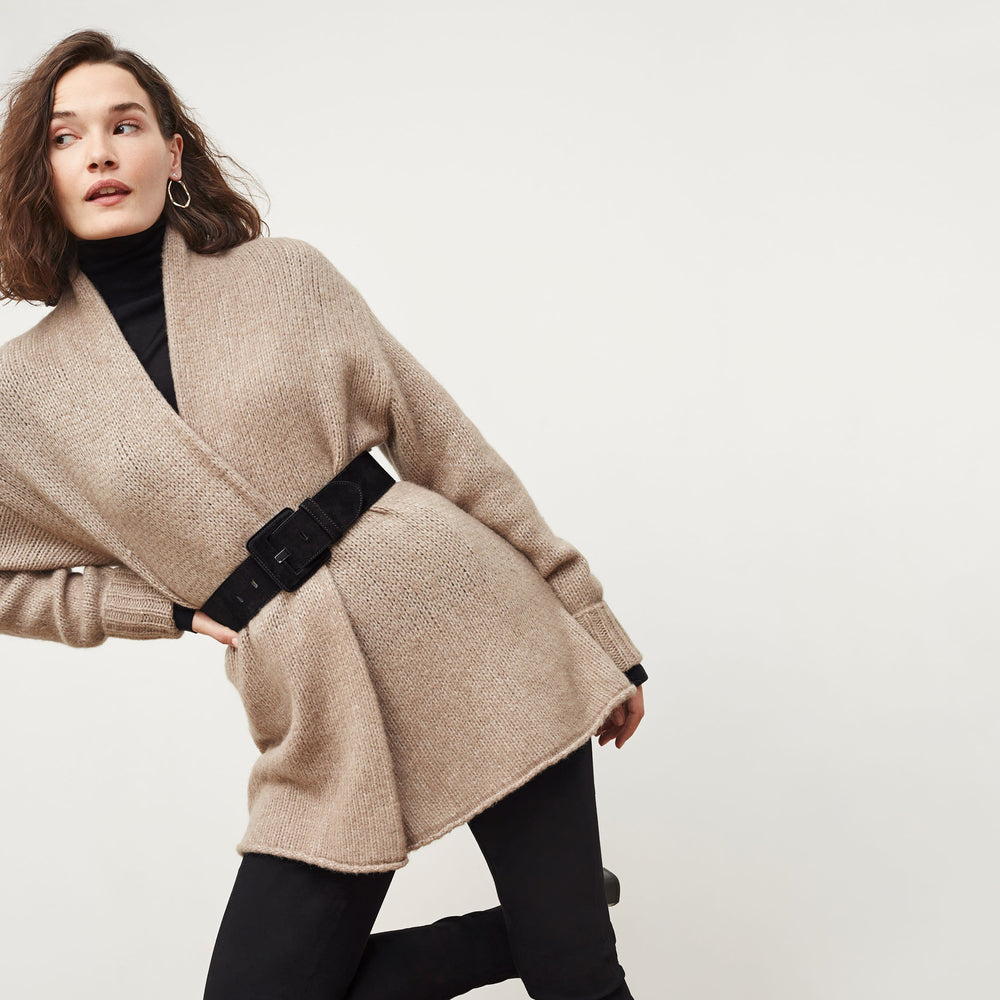 Front image of a woman standing wearing the Frederick Cardigan in Dark Taupe