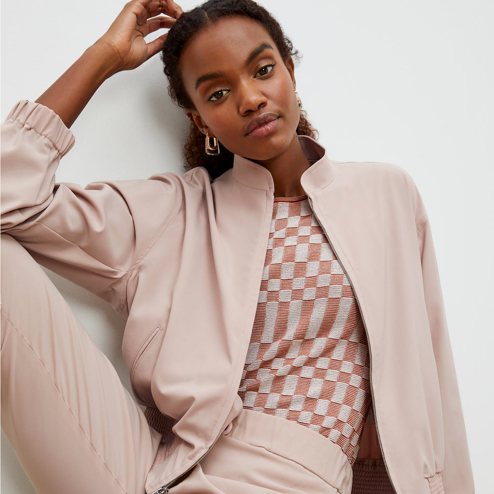 Front image of a woman wearing the Charli Top - Checkered Knit in Red Clay / Natural