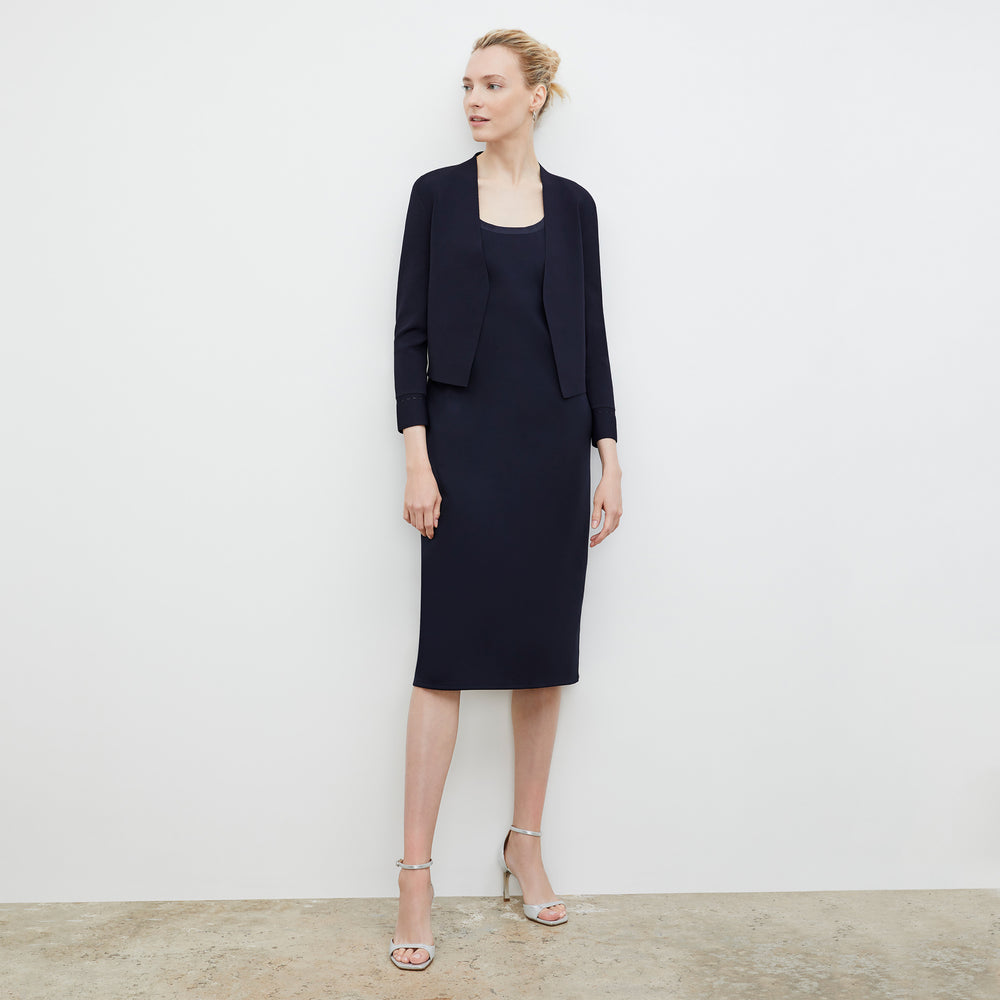 Front image of a woman wearing the Elsa Dress - Light Scuba in Space Blue