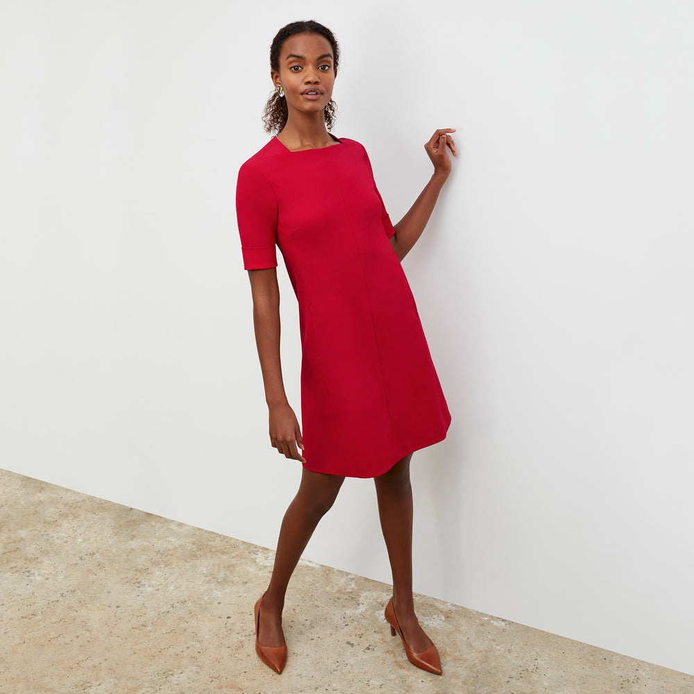 Front image of a woman wearing the Emily Dress - Recycled Wondertex in Rhubarb