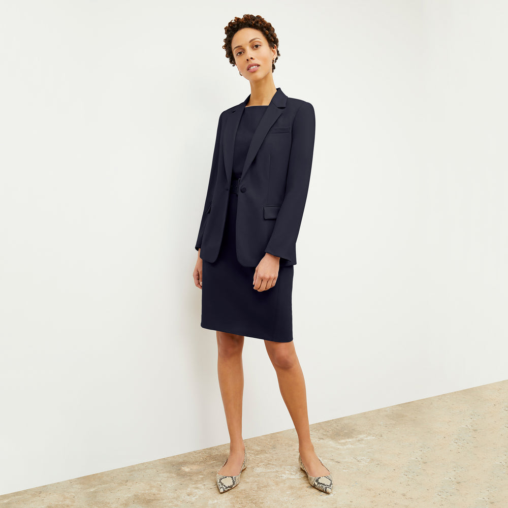 Front image of a woman wearing the Cynthia dress in Galaxy Blue