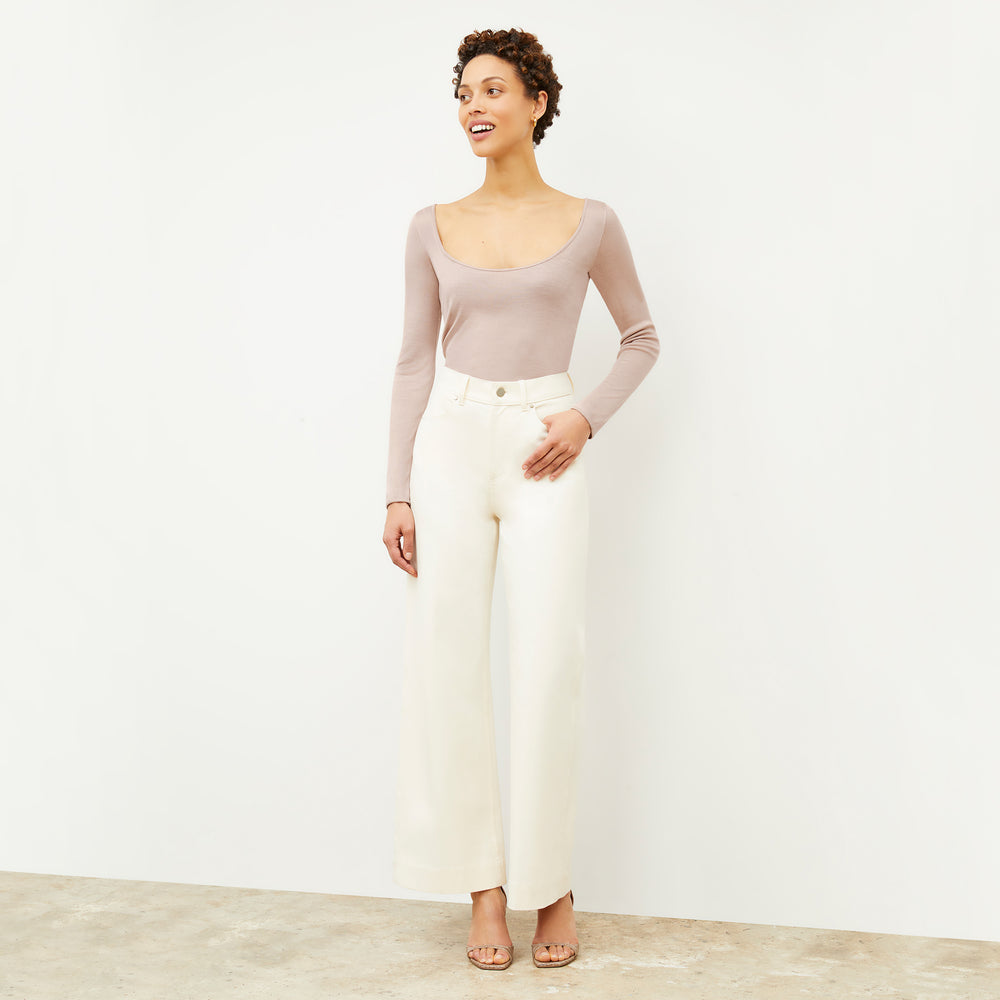 Front image of a woman wearing the Meg Top in Blush