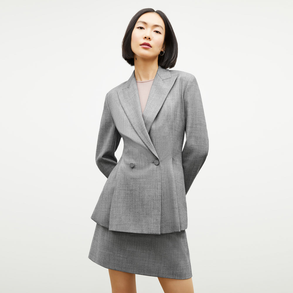 Front image of a woman wearing the Whitney Skirt in Black / White