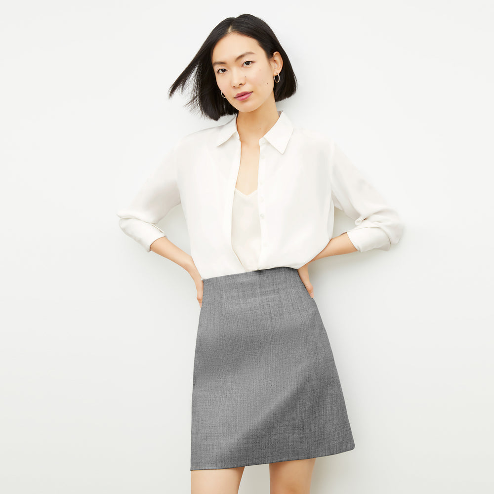 Front image of a woman wearing the Whitney Skirt in Black / White