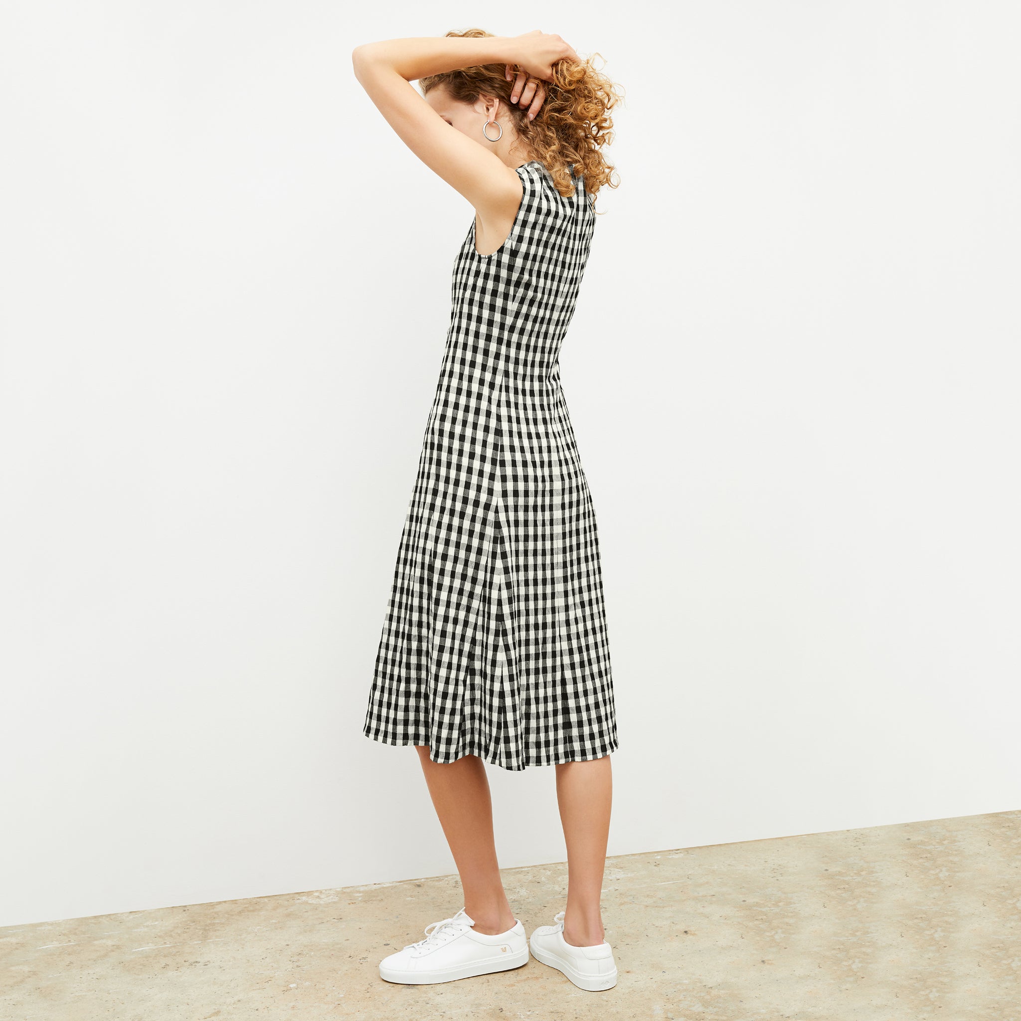 Back image of a woman wearing the nyla dress in black and white