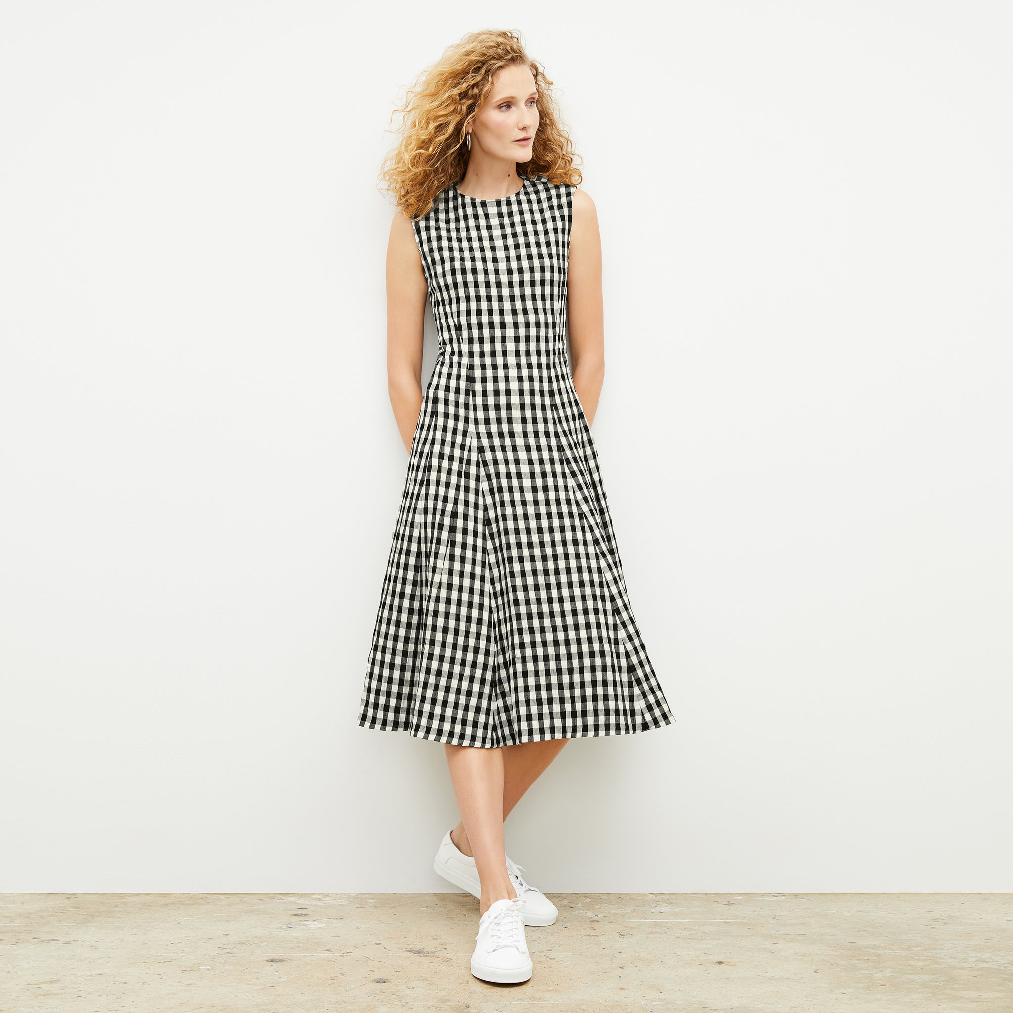 Front image of a woman wearing the nyla dress in black and white
