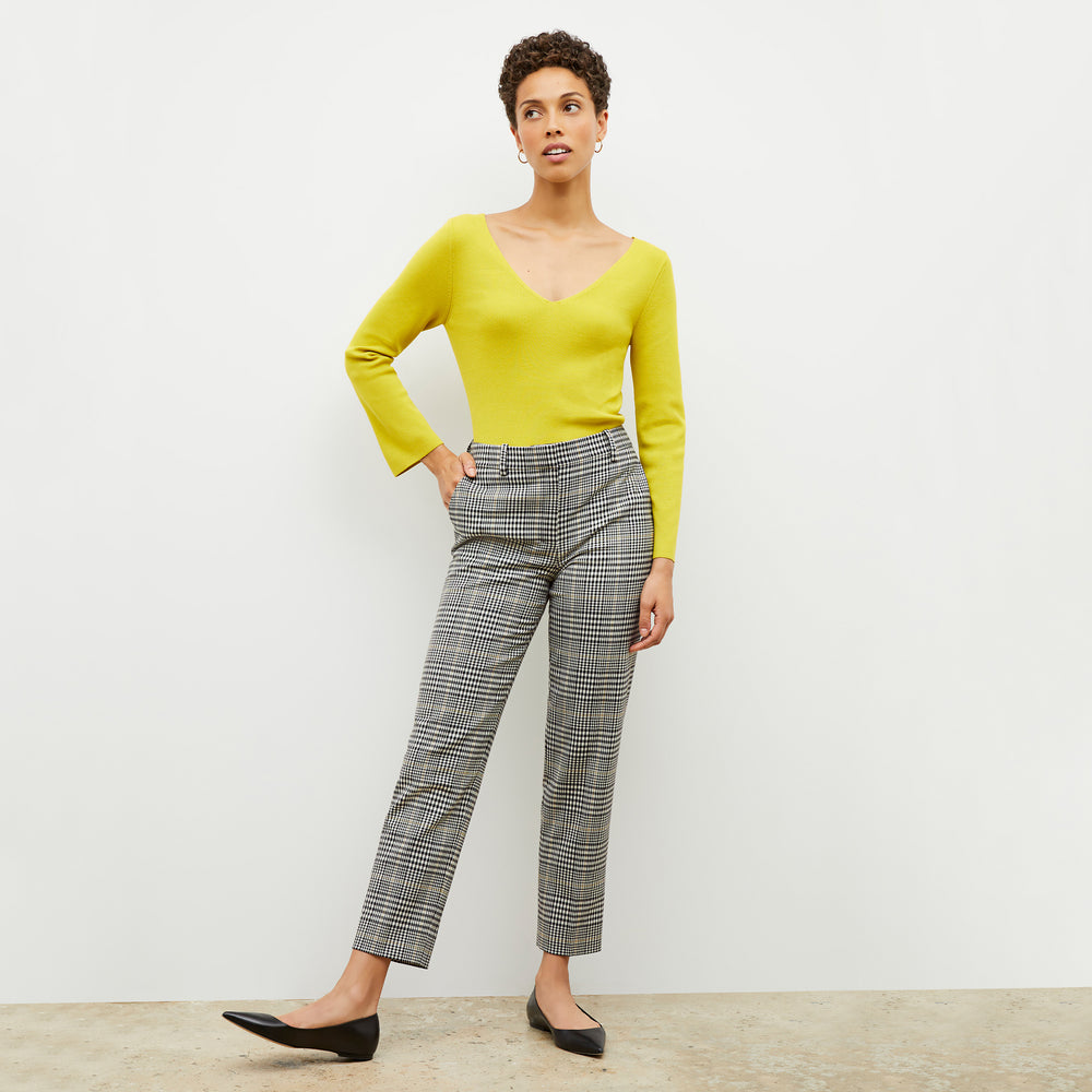 Front image of a woman wearing the kara top in chartreuse