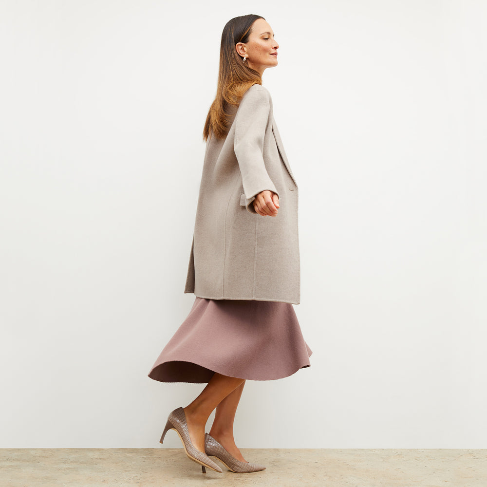 Front image of a woman wearing the kasha coat in stone melange