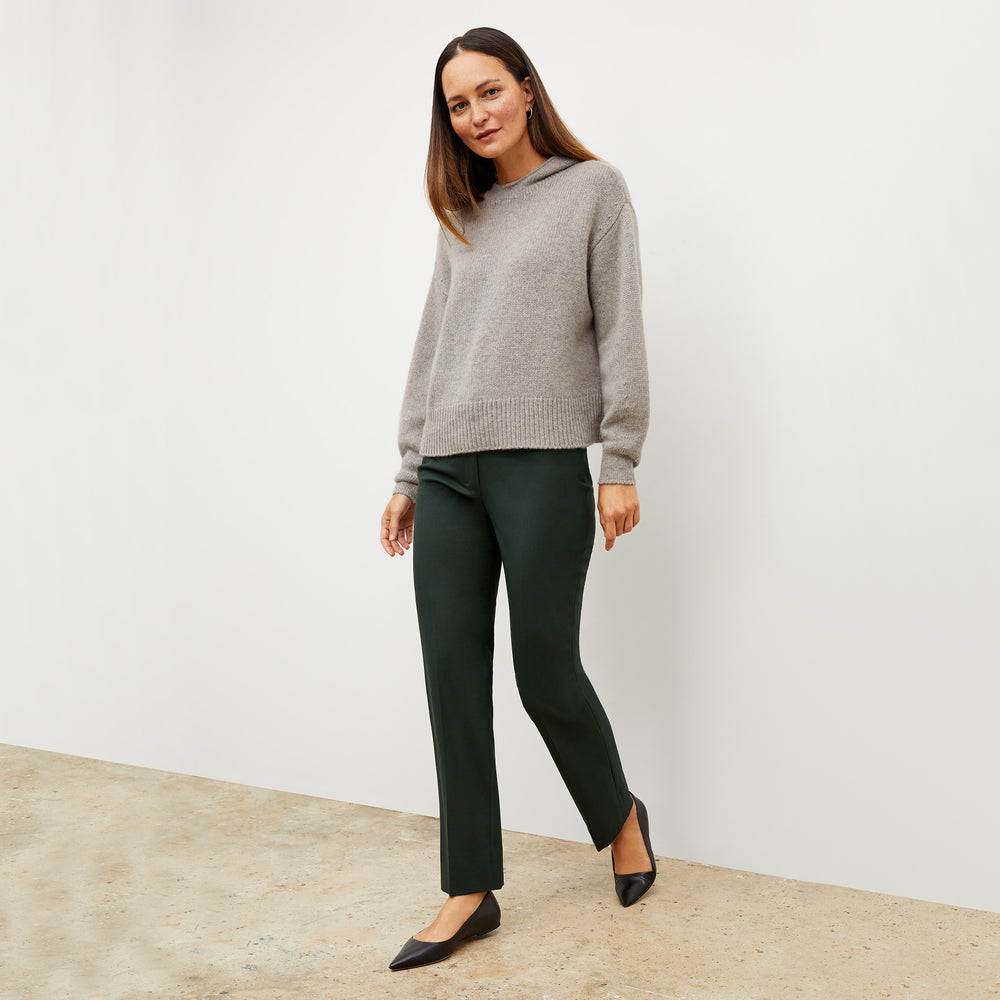 Front image of a woman wearing the thomas sweater in stormcloud