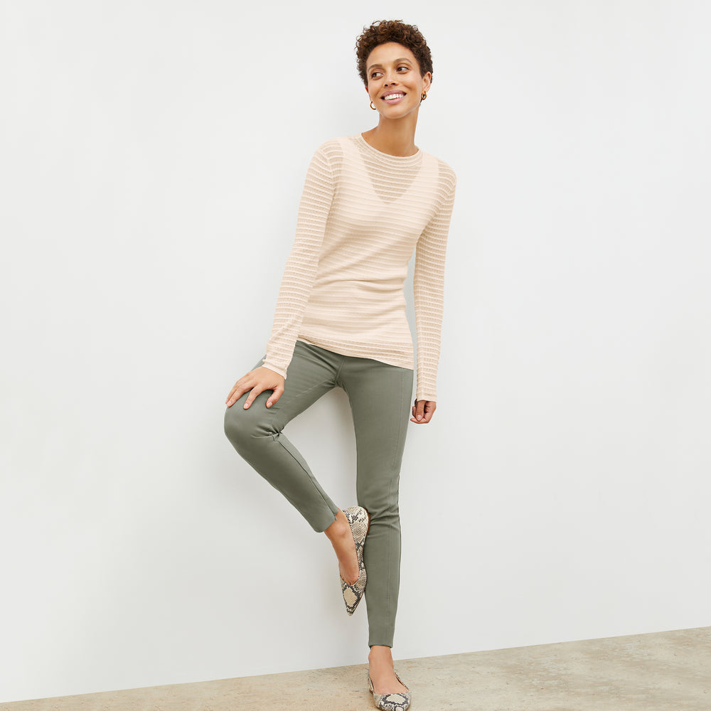 Front image of a woman wearing the Brodie Top in Meringue