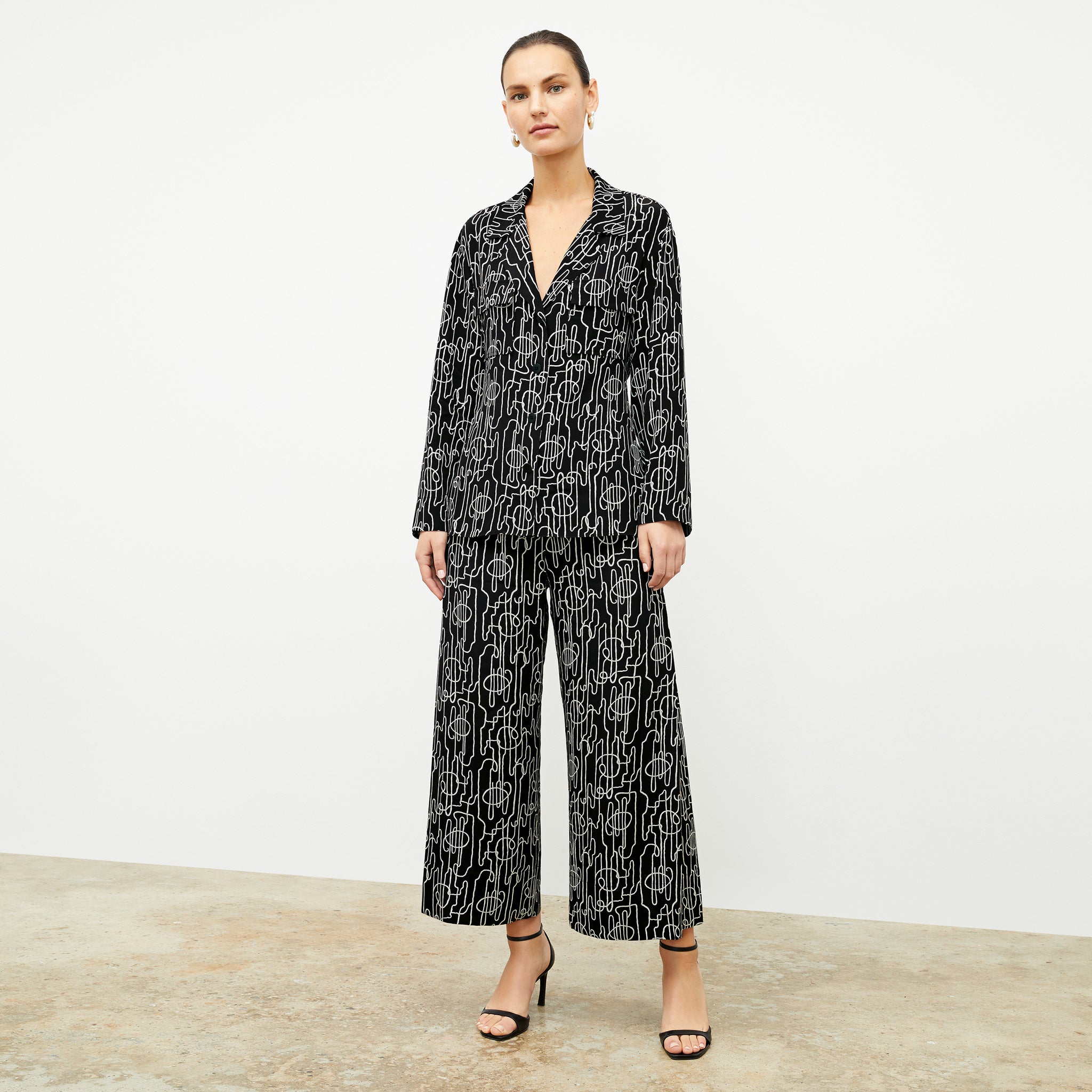 front image of a woman wearing the zhou culotte in symphony print