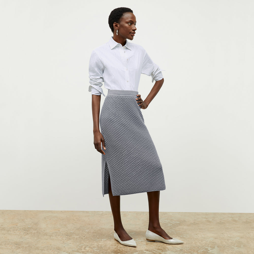 front image of a woman wearing the senga skirt in flint gray