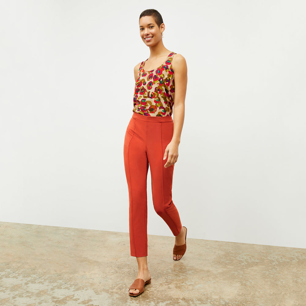 Front image of a woman wearing the Vicky Tank in Peacock Print
