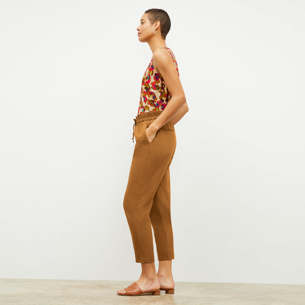 Side image of a woman wearing the Vicky Tank in Peacock Print